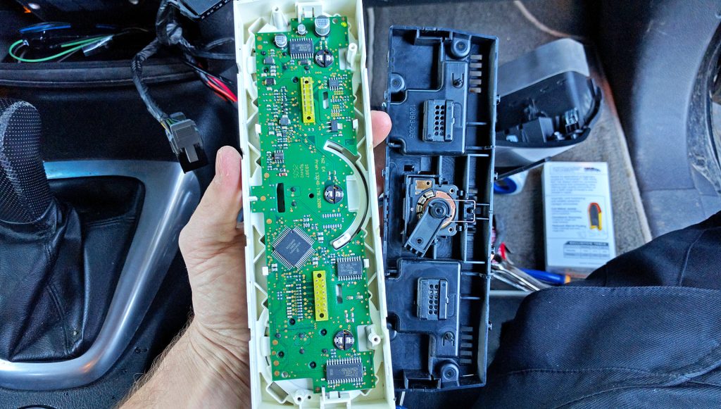 HVAC H3 Hummer Apart with old light bulbs exposed for replacement GM
